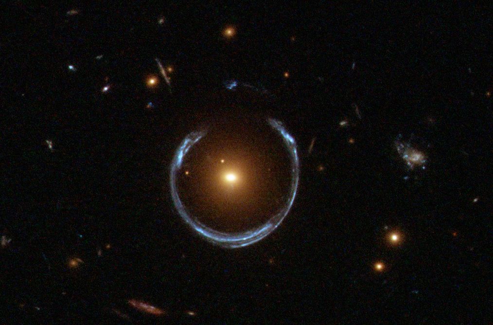 The gravity of a luminous red galaxy (LRG) has gravitationally distorted the light from a much more distant blue galaxy forming an Einstein Ring